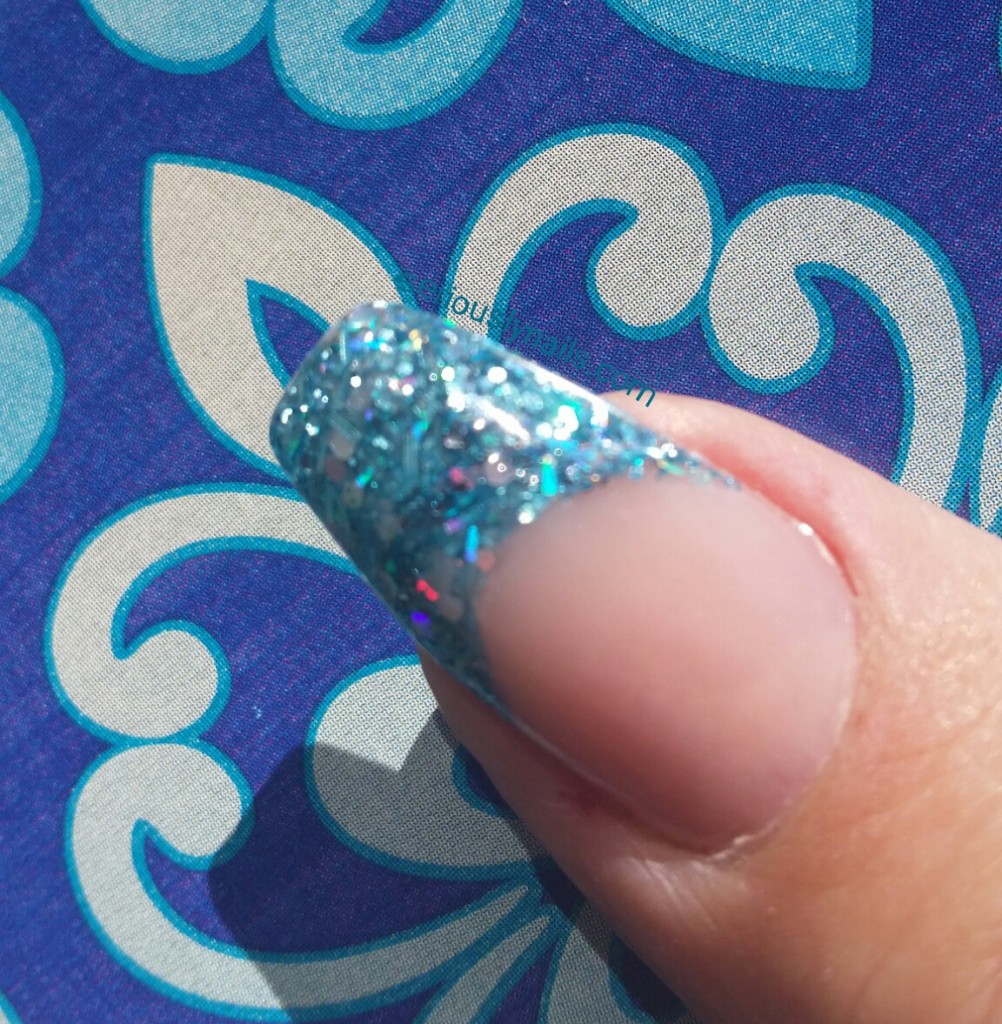 Outdoor shot of my French Mani using 'Rain for Days' Glitter acrylic from EZ Flow