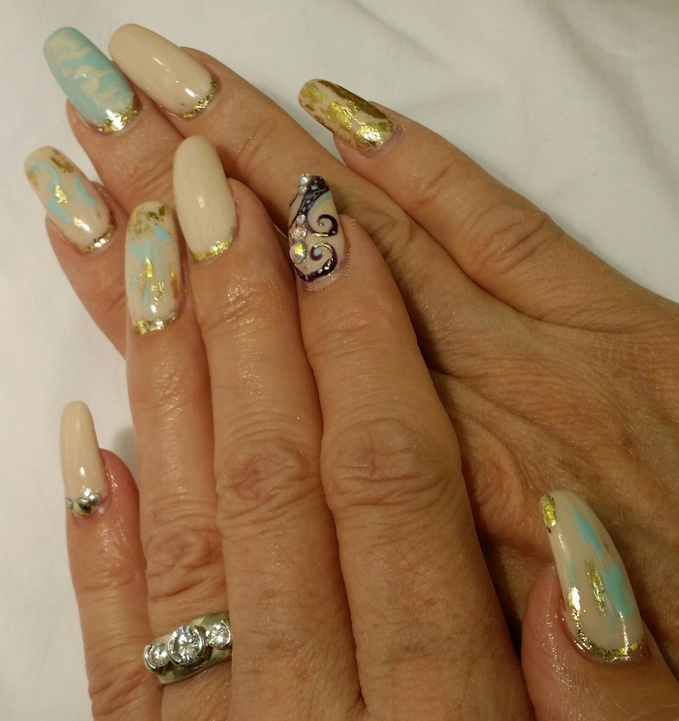 Extending the life of my gel mani by adding gold foil around my cuticles!